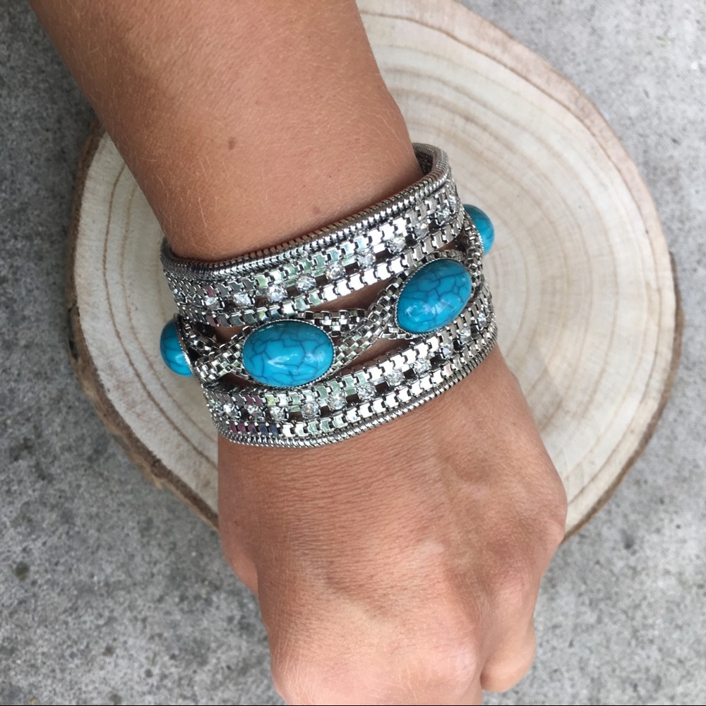 Turquoise and silver tone bracelet. 27